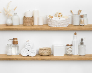 Fototapeta na wymiar Body care cosmetics with spa accessories arranged on wooden shelves