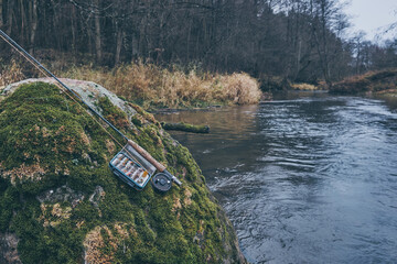 Fishing gear. Fly fishing on a mountain river.
