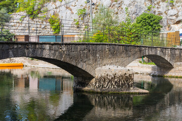 Fototapeta na wymiar View of the stone arch bridge in the town of Blagaj. Bosnia and Herzegovina