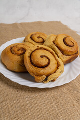 CInnamon Rolls on Box and Plate 