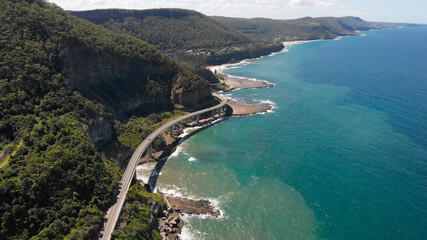 Obraz premium Sea Cliff Bridge in Australia. It's a beautiful road along the ocean. Beautiful scenery on a bright summer day.