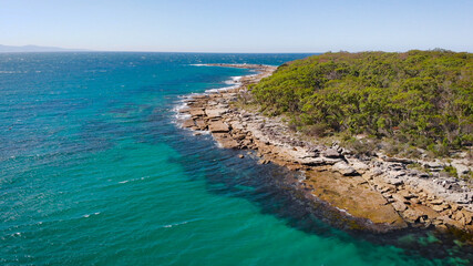 Fototapeta na wymiar Jervis Bay in Australia. Scenic rocky shore and clear ocean water.