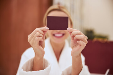 Spa client covering her face with a card