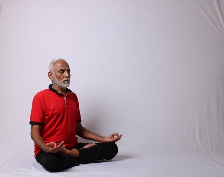 senior Indian man in yoga pose