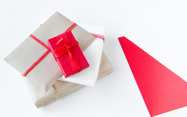 Several gifts in different packaging, decorated with ribbon and ropes. Gift wrapping, bright paper. Copy space.