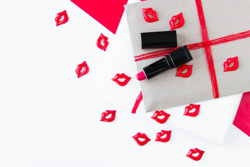 Fototapeta na wymiar Gift wrapping. Bright paper, gifts with kisses and lipstick on them. Place to copy.
