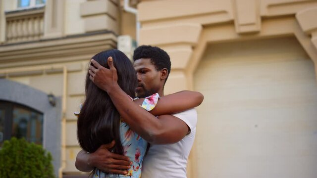 Hot african couple dancing in city. Professional dancers practicing on street