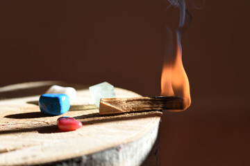 Palo santo lit before blowing and aromatizing the space