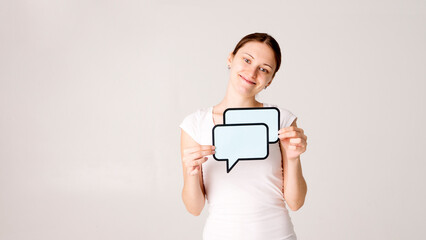 Woman shows sign speech bubbles. Speech bubble banner. Happy girl hold empty speech bubbles.