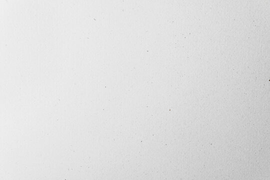 Eco friendly blank light grey recycled craft paper for the environment to be used as a background or backdrop.