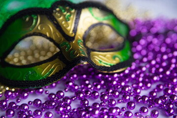 Mardi gras beads and mask close up