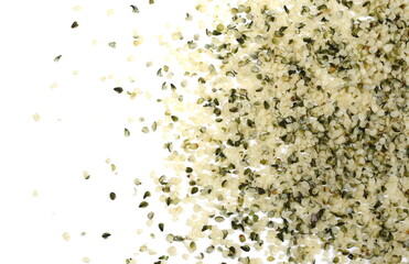 Peeled hemp seed pile isolated on white background, top view