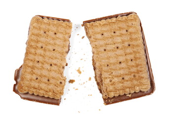 Broken chocolate cookie with crumbs isolated on white background, top view