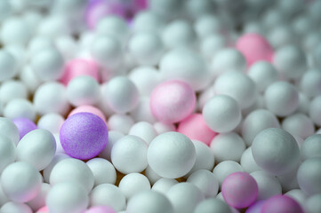 Colorful foam ball on wooden background
