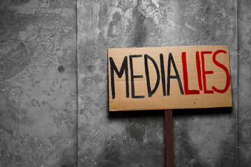 Fototapeta premium Protest placard against fake news about outbreak 2019-nCoV and treatment