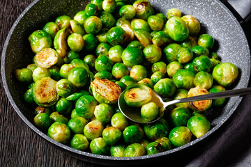 Brussels sprouts on a dark wooden background