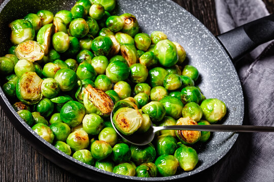 Brussels sprouts on a dark wooden background