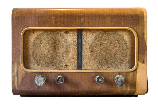 Antique broadcast radio receiver isolated from white background. This old one is made of wood.