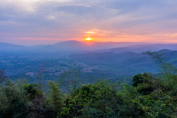 Sunset behind mountain at Pha Kep Tawan viewpoint. Scenery view  in Wang Nam Khiao, Nakhon Ratchasima, Thailand, Southeast Asia.
