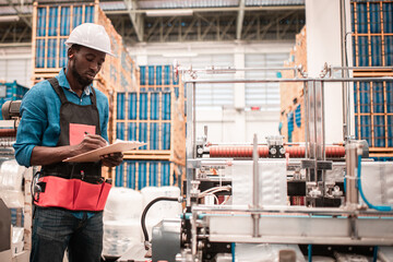 Technician working in factory check functionality while commissioning a production line, Man working