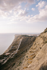 Fototapeta na wymiar High coast and walking stairs to the sea.