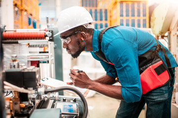 Technician working in factory check functionality while commissioning a production line, Man working