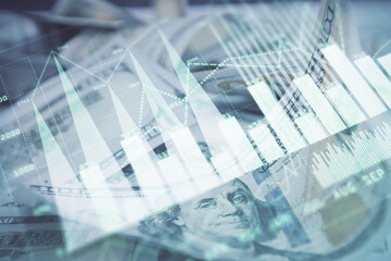 Double exposure of forex graph drawing over us dollars bill background. Concept of financial markets.