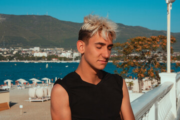 Fototapeta premium Young tourist is resting at the sea.
