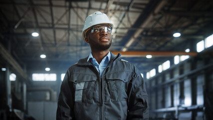 Portrait of Professional Heavy Industry Engineer/Worker Wearing Uniform, Glasses, Hard Hat in Steel...