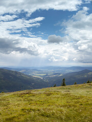 Green hills and stormy sky during a trekking in the polish mountains of Sudety.