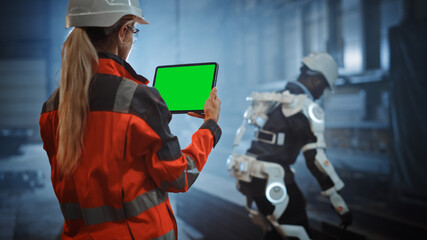 Professional Heavy Industry Female Engineer Uses Digital Tablet with Green Screen Mock Up Display,...