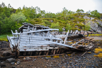 Old wood shipwreck onshore, Norway