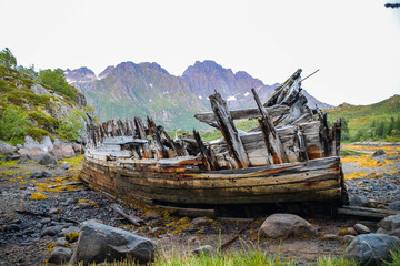 Fototapeta na wymiar Old wood shipwreck onshore, Norway