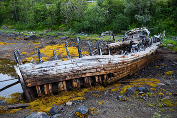 Old wood shipwreck onshore, Norway