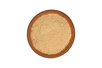 Bio organic dried ginger powder in wooden bowl