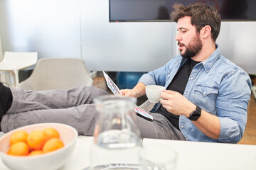 Web designer takes a coffee break in the office