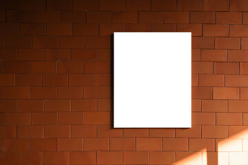 empty white frame hanging on red brick wall background