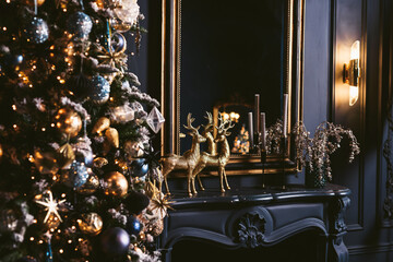 Merry Christmas and Happy New Year Holidays Decorating the Christmas tree indoors. Macro or close up picture of xmas tree and gifts under it. Background for gift card