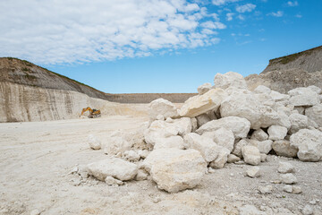 Pile of limestone rocks in the quarry containing 63 million year old fossils. Faxe Kalkbrud,...