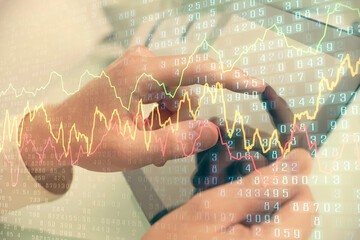 Multi exposure of man's hands holding and using a phone and financial chart drawing. Market analysis concept.