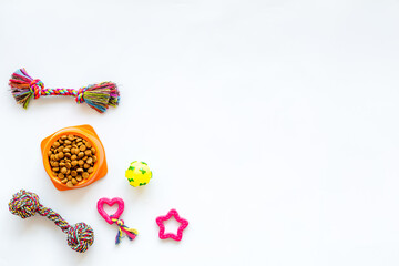 Pet toys and dry food for dogs and cats. Top view