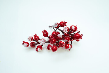 Christmas and new year background. Snowy rosehip. Handmade, rustic home decor. red berries holly...