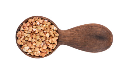 Buckwheat groats in wooden spoon, isolated on white background. Green buckwheat seeds. Top view.