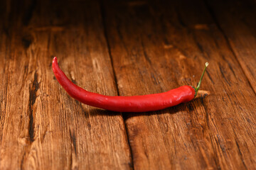 Hot chilli on the wooden table.