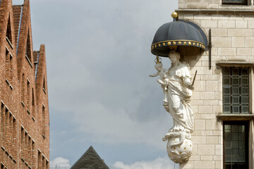 Fototapeta na wymiar religious statue on the street corner in Antwerp, Belgium