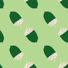 Doodle seamless fall pattern with green and white colored acorn ornament. Pastel background.