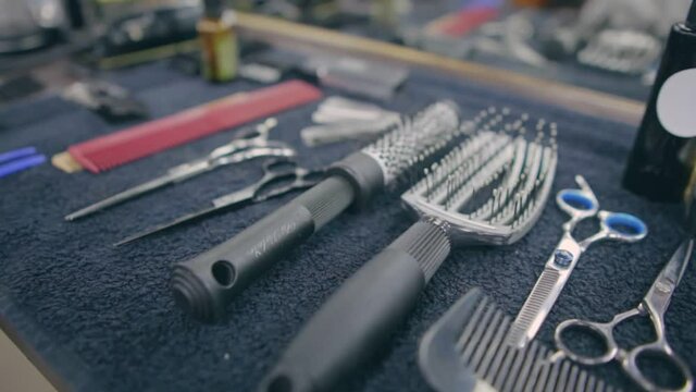 Hair combs and scissors on the barber's table. Close-up.