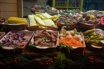 Nice street food shashlik, lavash, kebab, hachapuri and roasted potato on national Christmas Fair in Kiev, Ukraine