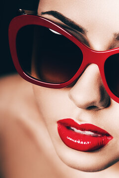 pretty hot woman in red sunglasses