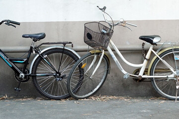 Fototapeta na wymiar A bicycle stoarge beside the cement wall.